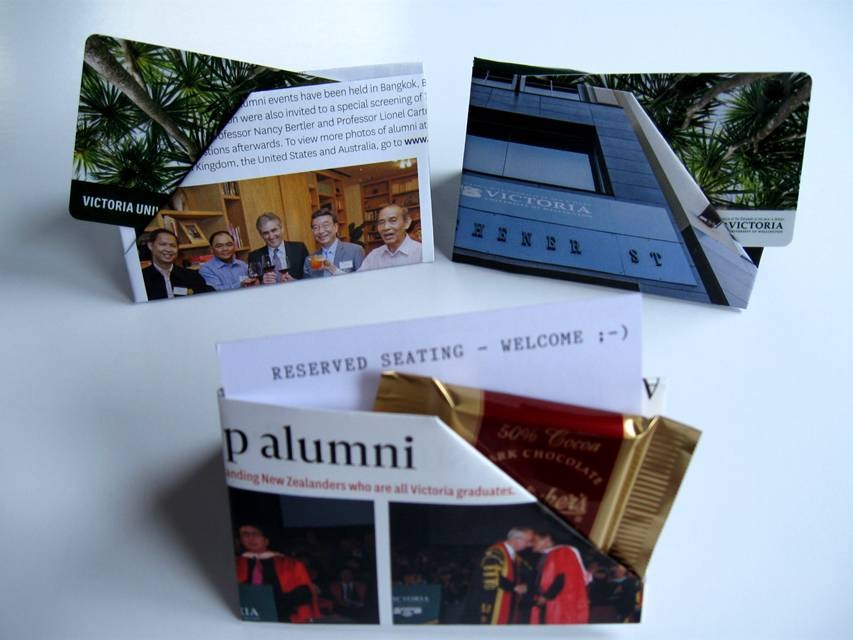 Origami card holders made from VUW's 'Victorious' publication